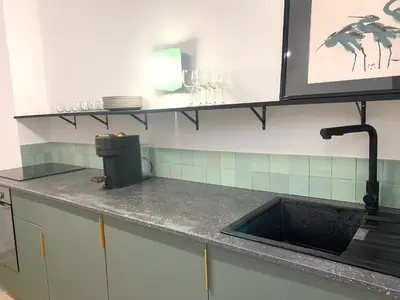 Cuisine ou kitchenette dans l'établissement La Maison By Simone T4