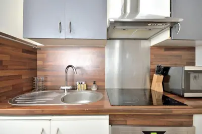 Cuisine ou kitchenette dans l'établissement Home Sweet Home