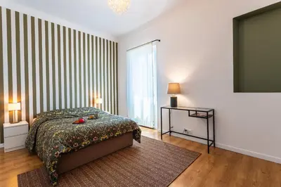 Un ou plusieurs lits dans un hébergement de l'établissement maison de ville La Fontaine BAu4