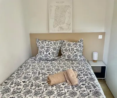 Un ou plusieurs lits dans un hébergement de l'établissement Appartement 2 pièces avec un jardin privatif