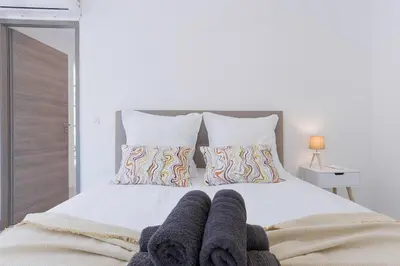 Un ou plusieurs lits dans un hébergement de l'établissement Cannes Molière - Palais, Plage, Balcon, Clim et Centre ville