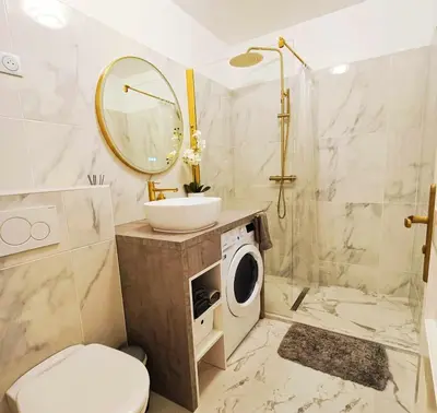 Salle de bains dans l'établissement La Résidence Fleuries - Plage