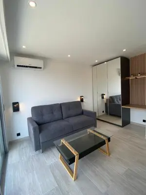 Coin salon dans l'établissement STUDIO HORIZON - SEA VIEW - POOL- Air Conditioner - Kitchen - Wifi -TV Train - Bus -