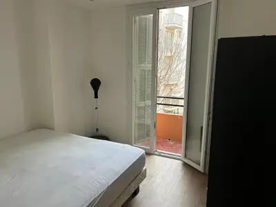 Un ou plusieurs lits dans un hébergement de l'établissement Joli appartement en bord de mer