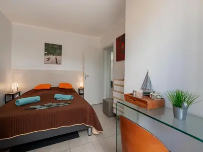 Un ou plusieurs lits dans un hébergement de l'établissement Apartment Les Girelles by Interhome