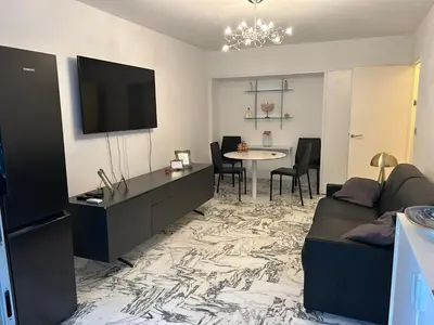 Télévision ou salle de divertissement dans l'établissement Appartement T2 bord de mer