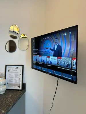 Télévision ou salle de divertissement dans l'établissement Studio Charlie - Bd de Lorraine