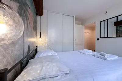 Un ou plusieurs lits dans un hébergement de l'établissement MACE Appartement avec SPA dans quartier Historique Exclusif Calme Coeur d'Antibes