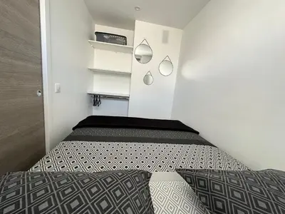 Un ou plusieurs lits dans un hébergement de l'établissement Appartement cosy à 2 pas de la Croisette