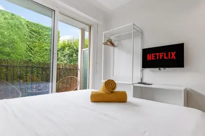 Un ou plusieurs lits dans un hébergement de l'établissement L'Emeraude - Calme - Plage - WIFI
