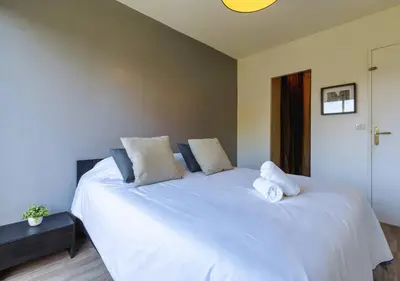 Un ou plusieurs lits dans un hébergement de l'établissement Appart 2 ch Vue Mer & Montagne, Terrasse, Parking