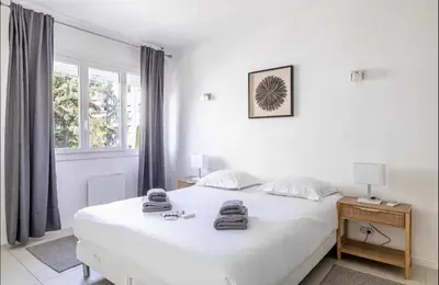 Un ou plusieurs lits dans un hébergement de l'établissement Appartement disign CLUB B