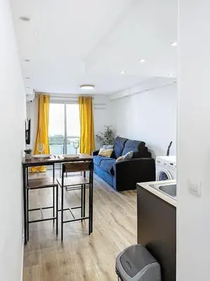 Coin salon dans l'établissement Studio proche mer - Climatisé
