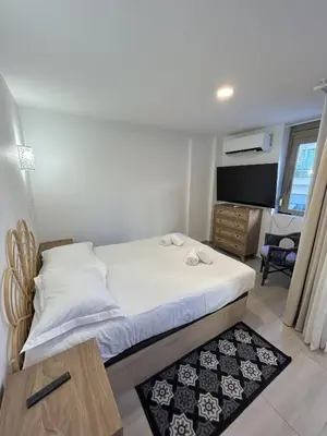 Un ou plusieurs lits dans un hébergement de l'établissement Residence Graziella Appartement 100