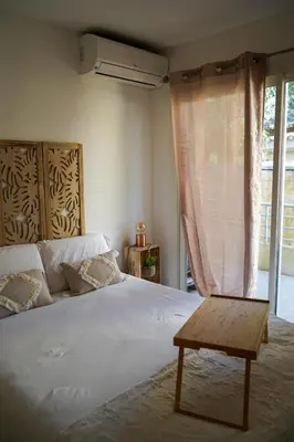 Un ou plusieurs lits dans un hébergement de l'établissement Cosy corner Paradise