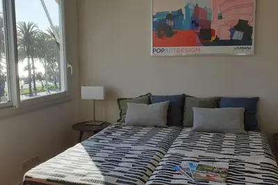 Un ou plusieurs lits dans un hébergement de l'établissement Cannes Croisette Loft vue mer