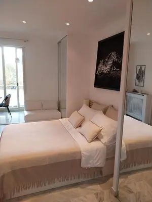 Un ou plusieurs lits dans un hébergement de l'établissement Palm beach Cannes La Brise