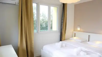Un ou plusieurs lits dans un hébergement de l'établissement Proche Croisette, Appartement 2 Chambres by Palmazur Vacances