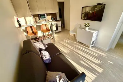 Coin salon dans l'établissement 1-bedroom apartment 50 m from the beach with terrace swimming pool AC