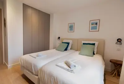 Un ou plusieurs lits dans un hébergement de l'établissement LE STANDING - Appartement de haut standing proche du port