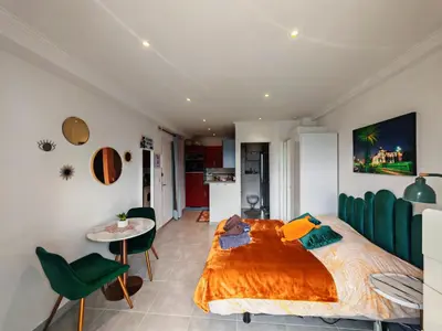 Un ou plusieurs lits dans un hébergement de l'établissement Studio Beach