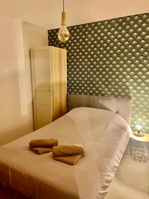 Un ou plusieurs lits dans un hébergement de l'établissement Appartement Cosy, Calme et Climatisé proche centre