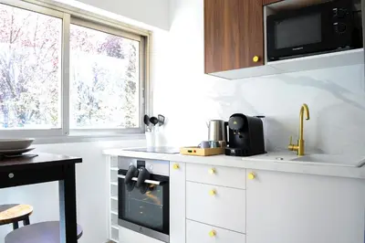 Cuisine ou kitchenette dans l'établissement Appartement Cosy, Calme et Climatisé proche centre