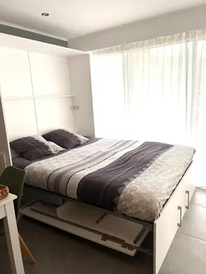 Un ou plusieurs lits dans un hébergement de l'établissement Studio Le Saint Honorât Juan les pins