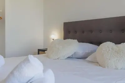 Un ou plusieurs lits dans un hébergement de l'établissement Appartement Azzuro - Welkeys