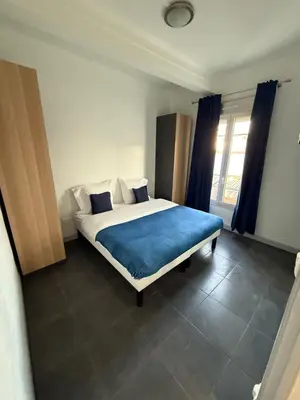 Un ou plusieurs lits dans un hébergement de l'établissement Cannes Sun, appart'hôtels