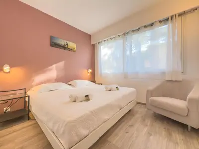 Un ou plusieurs lits dans un hébergement de l'établissement Le Cozy by Winsome Destination