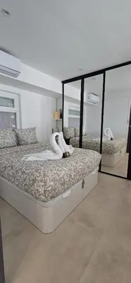 Un ou plusieurs lits dans un hébergement de l'établissement Le Romance - Palm Beach - Sea View - Wi-Fi - Air Conditioning