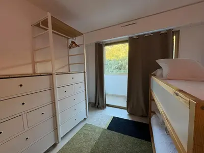 Un ou plusieurs lits dans un hébergement de l'établissement Chic 2 bedroom with Huge Terrace and Pool Cannes
