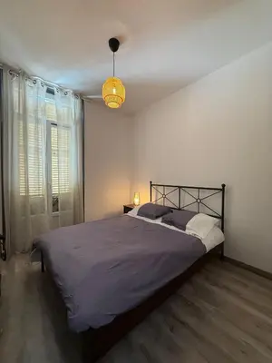 Un ou plusieurs lits dans un hébergement de l'établissement Appartement au cœur du Vieil Antibes