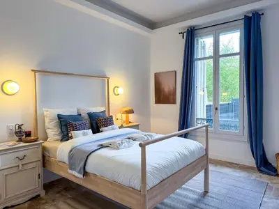 Un ou plusieurs lits dans un hébergement de l'établissement Bel appartement rénové - Jardin et Parking - DA