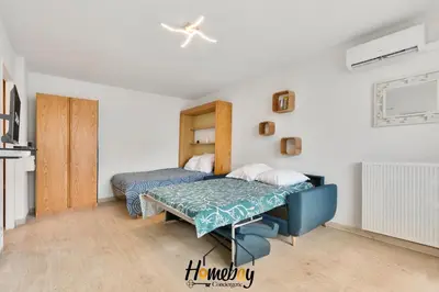 Un ou plusieurs lits dans un hébergement de l'établissement Studio Cosy, Emplacement Idéal 2 minute des plages