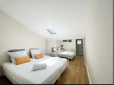 Un ou plusieurs lits dans un hébergement de l'établissement Appartement, proche du palais des festivals, plage et commerces