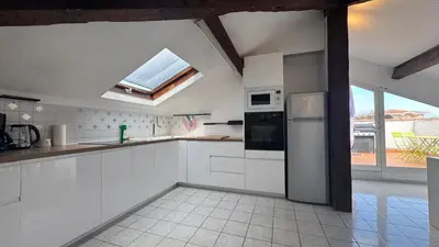 Cuisine ou kitchenette dans l'établissement Reine des Mers