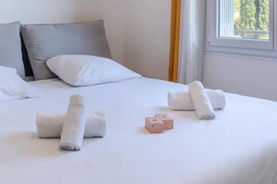 Un ou plusieurs lits dans un hébergement de l'établissement Appartement Rochat - Welkeys
