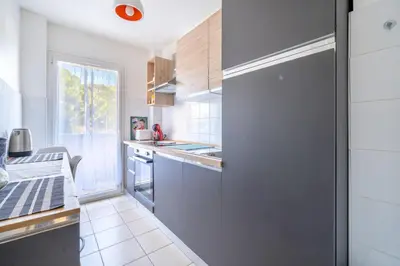 Cuisine ou kitchenette dans l'établissement Appartement Rochat - Welkeys