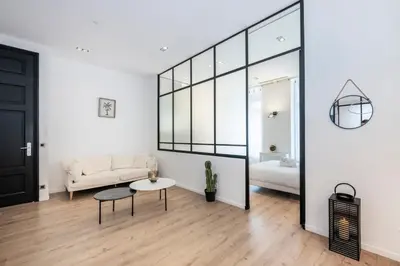 Un ou plusieurs lits dans un hébergement de l'établissement Le 121 - LOFT design Rue d'Antibes