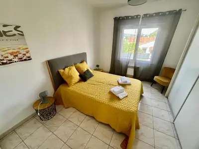 Un ou plusieurs lits dans un hébergement de l'établissement Charmant 2 pièces, terrasse 30m2