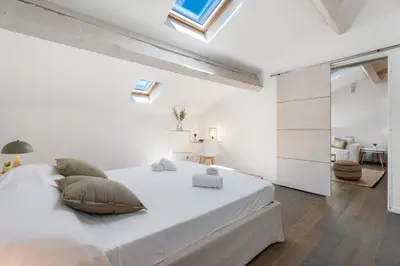 Un ou plusieurs lits dans un hébergement de l'établissement Appartement Reyer - Welkeys