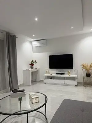Télévision ou salle de divertissement dans l'établissement Le Prestigieux - plage
