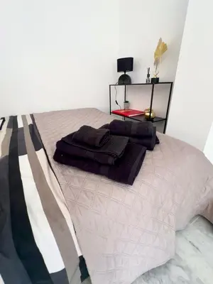 Un ou plusieurs lits dans un hébergement de l'établissement studio luxueux