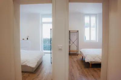 Un ou plusieurs lits dans un hébergement de l'établissement Cozy Home Cannes