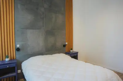 Un ou plusieurs lits dans un hébergement de l'établissement Cozy Home Cannes