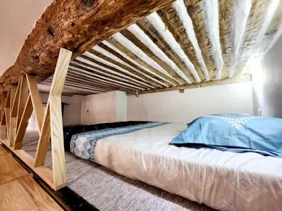 Un ou plusieurs lits dans un hébergement de l'établissement Le Bourgarel - Studio dans Vieil Antibes