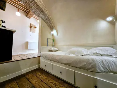Un ou plusieurs lits dans un hébergement de l'établissement La Studette Bain - Studio au coeur du vieil Antibes