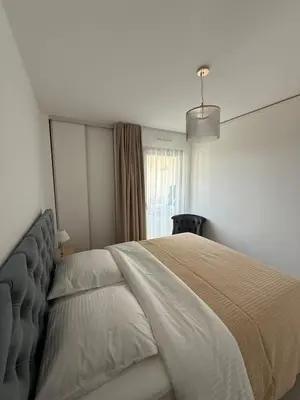 Un ou plusieurs lits dans un hébergement de l'établissement Appartements en bord de mer